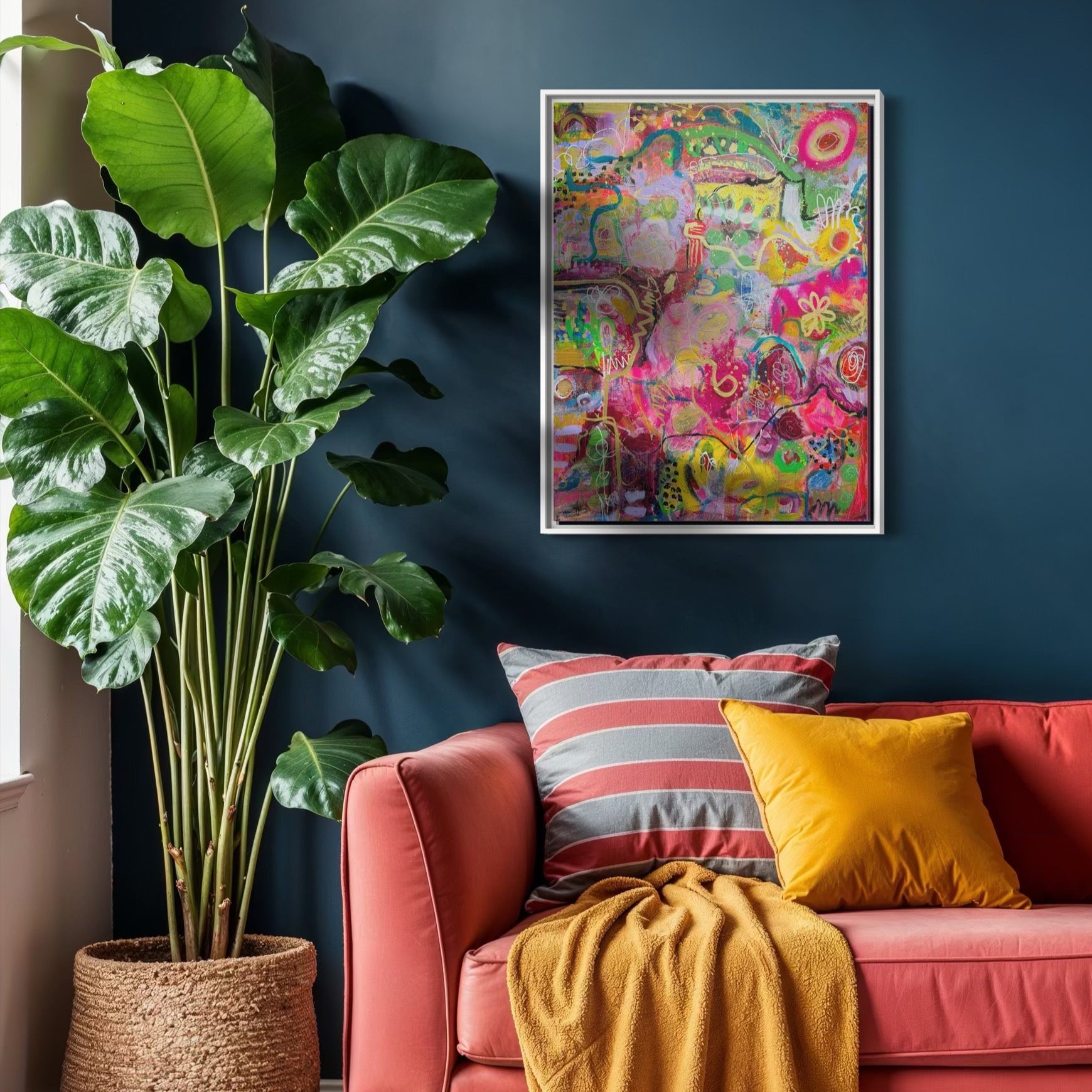 Living room with a red sofa, colorful cushions, and a vibrant painting on a dark blue wall.