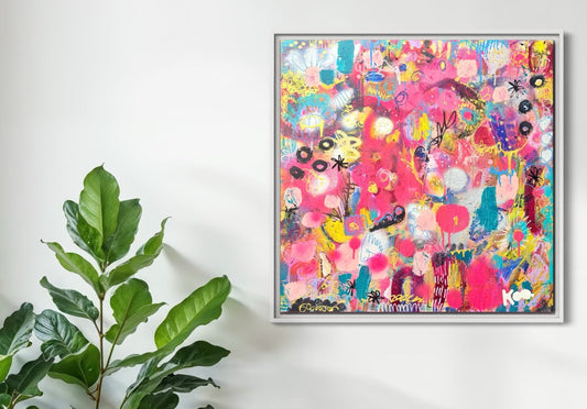 Dining area with wooden table and chairs, plant, and colorful abstract painting on wall.